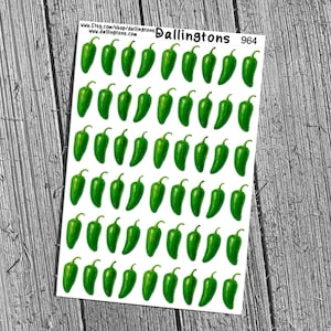 May include: Sheet of stickers featuring green jalapeño peppers on a white background. The stickers are arranged in rows and columns. The text "Dallingtons 964" is printed on the top right corner. The background is a wooden surface.