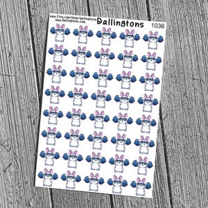 May include: Sheet of stickers featuring cartoon bunnies lifting weights. The bunnies have pink ears and headbands, and are lifting blue barbells. The stickers are on a white background, with the text "Dallingtons 1036" at the top.
