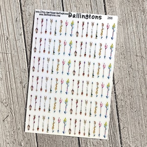 Puede incluir: Una hoja de pegatinas de flechas de colores con varios diseños y patrones. Las pegatinas están sobre un fondo blanco y están dispuestas en filas. La hoja está etiquetada "Dallingtons 266".