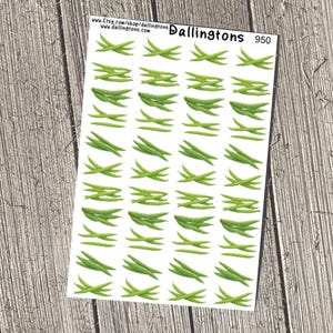 May include: A sheet of stickers featuring green bean illustrations. The stickers are arranged in rows and columns on a white background. The sheet has the text "Dallingtons 950" and a website address.