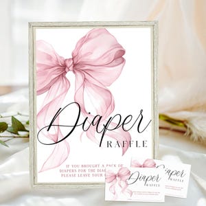 May include: A framed sign and cards with a pink watercolor bow and the words "Diaper Raffle." The sign has the text "If you brought a pack of diapers for the diaper raffle, please leave your..." The cards have the same bow design.