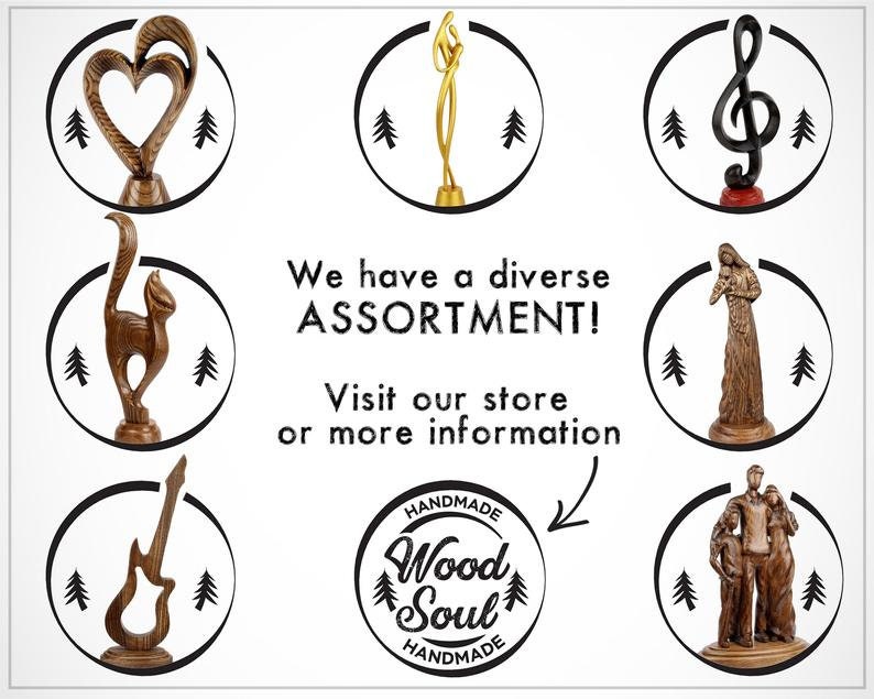 May include: A collection of wooden sculptures, including a heart, a cat, a guitar, a treble clef, a woman holding a baby, and a family of three. The sculptures are all hand-carved and have a rustic, natural look. The text "We have a diverse ASSORTMENT! Visit our store or more information HANDMADE Wood Soul HANDMADE" is displayed on the image.