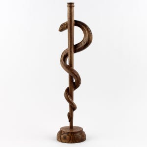 Designed to fit seamlessly into any office, library, or study, this wooden medical decor measures approximately [insert dimensions]. 

Whether placed on a desk, bookshelf, or reception counter, it is an eye-catching symbol of medicine and healing. A must-have for doctors, healthcare professionals, and medical students looking for meaningful office decor.