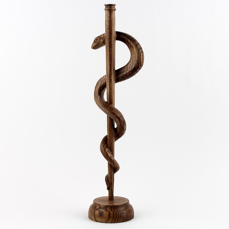 Designed to fit seamlessly into any office, library, or study, this wooden medical decor measures approximately [insert dimensions]. 

Whether placed on a desk, bookshelf, or reception counter, it is an eye-catching symbol of medicine and healing. A must-have for doctors, healthcare professionals, and medical students looking for meaningful office decor.