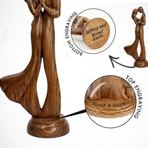 May include: A wooden sculpture of two people embracing. The sculpture is engraved with the names "Jeffrey and Romel" and the date "6/22/19".