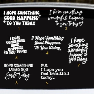 May include: A selection of white vinyl decals with motivational quotes on a black backdrop. The phrases include "I hope something good happens to you today" and "Hope something makes you smile today."