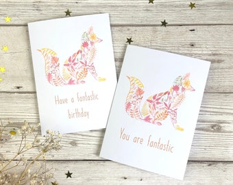 May include: Two greeting cards with a floral fox design. The card on the left says "Have a fantastic birthday". The card on the right says "You are fantastic".