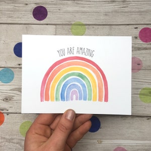 May include: A white card with a rainbow watercolour illustration and the text "You are amazing".