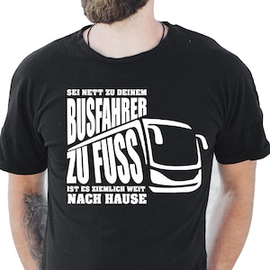 May include: Black t-shirt with white text and a bus graphic. The text reads "SEI NETT ZU DEINEM BUSFAHRER ZU FUSS IST ES ZIEMLICH WEIT NACH HAUSE."