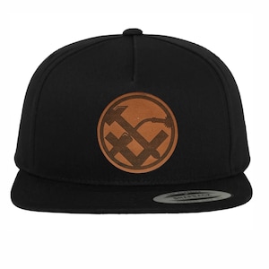 Metalworker craftsman hat cap with leather patch coat of arms sign