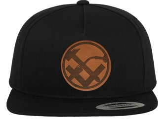 Metalworker craftsman hat cap with leather patch coat of arms sign