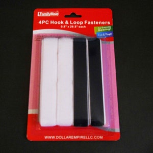 May include: A package of 4 white and black hook and loop fasteners, each measuring 0.8 inches by 29.5 inches. The package is labeled "FamilyMaid 4PC Hook & Loop Fasteners 0.8" x 29.5" each For Everyday Sewing Cut & Peel! www.DOLLAREMPIRELLC.COM"