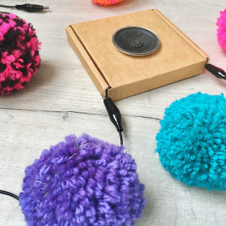 played by squeezing pompoms! DIY Pompom Musical Instrument Kit craft with e-textiles to make an electronic musical instrument