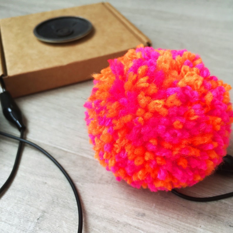 played by squeezing pompoms! DIY Pompom Musical Instrument Kit craft with e-textiles to make an electronic musical instrument