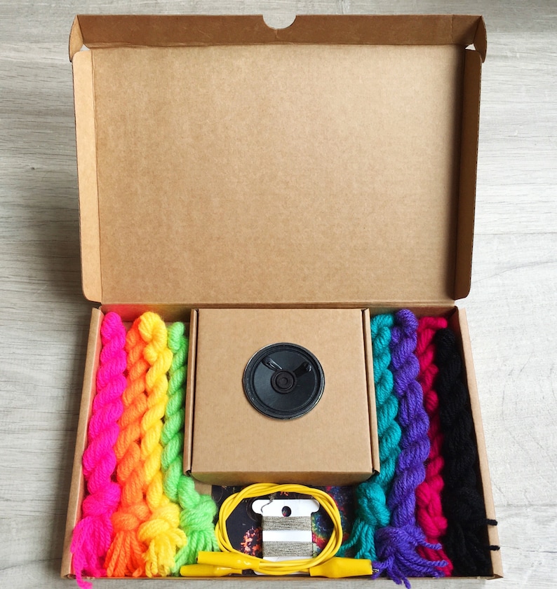played by squeezing pompoms! DIY Pompom Musical Instrument Kit craft with e-textiles to make an electronic musical instrument