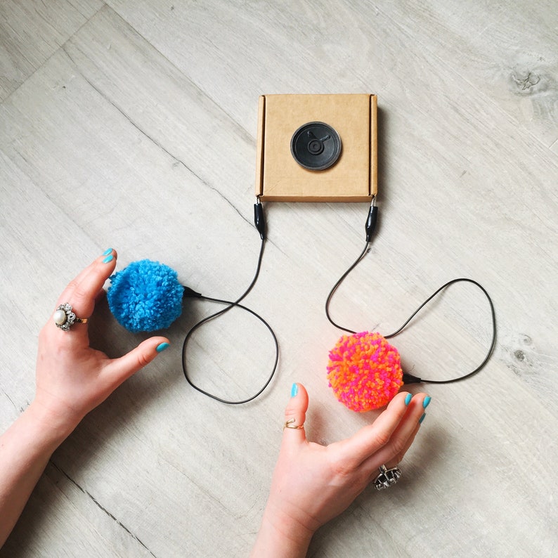 played by squeezing pompoms! DIY Pompom Musical Instrument Kit craft with e-textiles to make an electronic musical instrument
