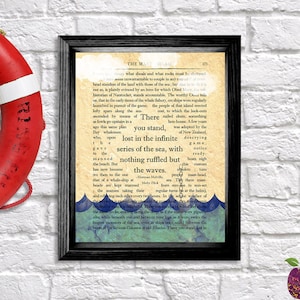 May include: A framed print of a vintage book page with text about the sea and waves. The text is "There you stand, lost in the infinite series of the sea, with nothing ruffled but the waves."