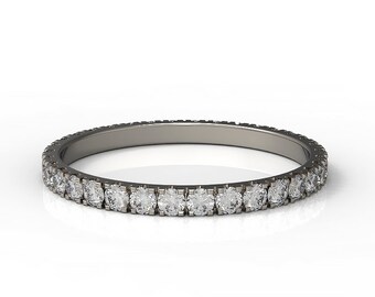 May include: A thin silver band with a row of small, round diamonds set in a pave setting.