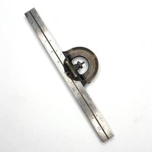 May include: A vintage combination square tool with a steel ruler and a cast iron body. The ruler is marked with inch measurements up to 11 inches. The tool is designed for measuring angles and lengths.