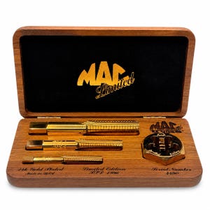 May include: A wooden display box containing three 24k gold plated metal taps and a matching die. The interior lid features the gold text MAC Limited. The base includes the text 24k Gold Plated, Limited Edition LTD 1996, and Serial Number 4490.