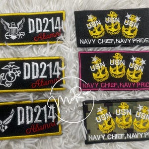 May include: Embroidered patches with military insignia and text. Patches include "DD214 Alumni" with eagle, globe, and anchor, and Air Force emblems. Other patches say "Navy Chief, Navy Pride" with anchors.