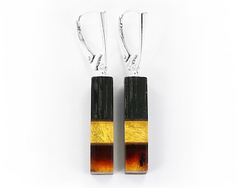 Silver rectangular dangling earrings with amber and black oak