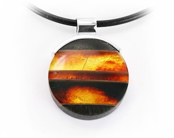 Round amber pendant made of silver and black oak wood, amber round pendant made of silver and black oak
