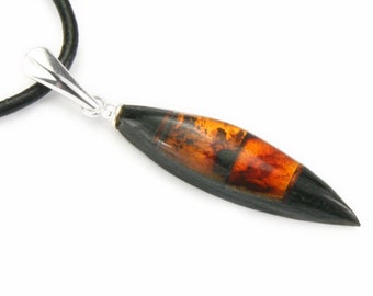 Amber pendant made of silver and wood black oak, bursztynowa zawieszka ze srebra i czarnego dębu