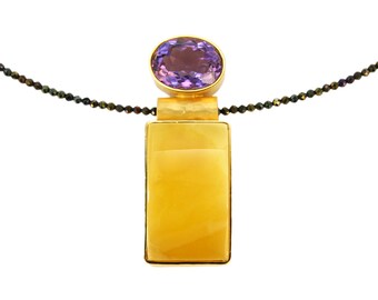 Gilded pendant with faceted amethyst, yellow amber and spinel