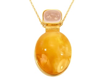 Gold-plated oval pendant on a chain with amber, black oak and rose quartz