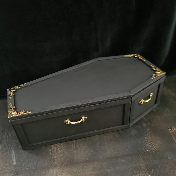 A handcrafted wooden coffin trinket box that doubles as a gothic display piece or photo prop — the kind of object that makes visitors stop and stare.