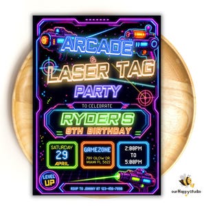 May include: A rectangular party invitation with a black background and neon-style graphics. It features laser guns, target symbols, and text reading ARCADE & LASER TAG PARTY TO CELEBRATE RYDER'S 8TH BIRTHDAY, with date, time, and location details.