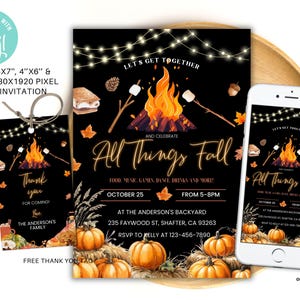 May include: Black invitation and thank you card set with a fall theme. The invitation reads "All Things Fall" with a bonfire illustration. A smartphone displays the invitation. The thank you card is tied with twine.