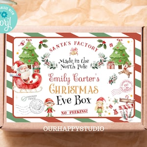 May include: A red and white striped box with a green and red border. The box has a label that says "Santa's Factory" and "Made in the North Pole". The label also has a personalised name, "Emily Carter's Christmas Eve Box". The box is decorated with Christmas trees, reindeer, and other festive imagery.