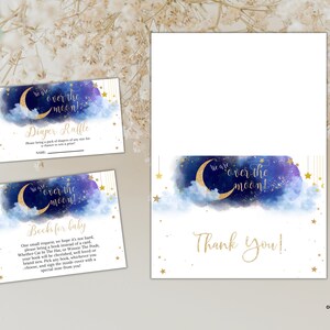 May include: Two printable cards with a blue and gold watercolour design featuring a crescent moon and stars. The text on the cards reads "We are over the moon!" and "Diaper Raffle".