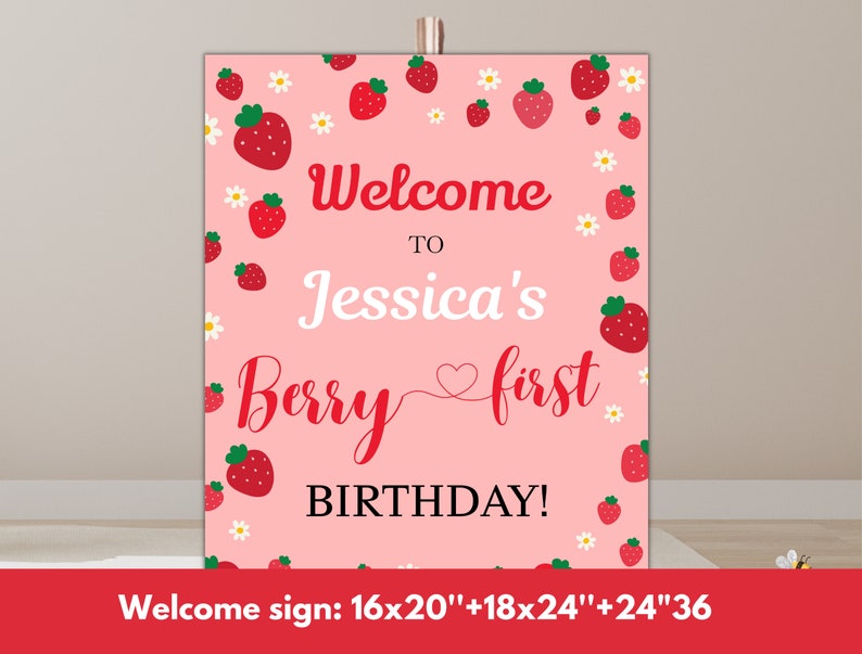 May include: Pink welcome sign with a strawberry theme. It says "Welcome to Jessica's Berry First Birthday!" with white daisies and red strawberries around the text.