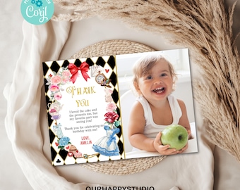May include: A thank you card with a black and white checkered background, a red bow, and a photo of a young child holding a green apple. The card says "Thank You" and includes the text "I loved the cake and the presents too, but my favorite part was seeing you! Thank you for celebrating my birthday with me! Love, Amelia".