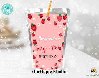 May include: Pink and white juice box with a straw, featuring a strawberry pattern and the text "Jessica's Berry first BIRTHDAY".