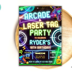 May include: A rectangular party invitation with a neon arcade and laser tag theme. The text reads ARCADE & LASER TAG PARTY TO CELEBRATE RYDER'S 10TH BIRTHDAY! Includes date, time, location, and RSVP details with pixelated graphics and laser guns.
