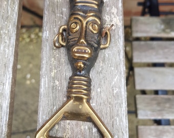 vintage antique 1930s souvenir bottle opener tribal heavy brass piece bar ware unusual design pattern boho retro