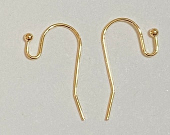 May include: Two gold-toned earring hooks with a small ball at the top of each hook.