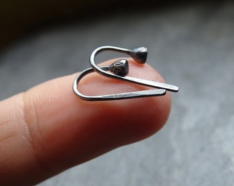 Mini silver earrings, tiny hoops.