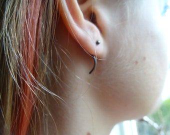 Mini silver earrings.