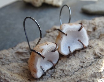Earthy geode quarts silver earrings with copper prongs.