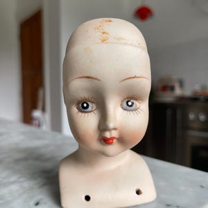 Vintage porseleinen poppenhoofd