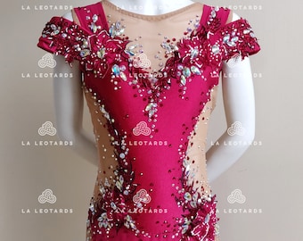May include: A red leotard with a sheer mesh overlay and intricate floral embellishments. The leotard features a scoop neck, sleeveless design, and a high leg cut. The embellishments include rhinestones, sequins, and beads.