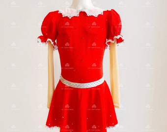 May include: Red velvet figure skating dress with white lace trim, puff sleeves, and a silver rhinestone belt.