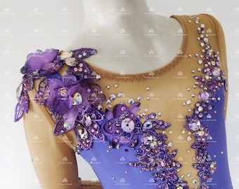 May include: A purple and brown leotard with a sheer bodice and long sleeves. The bodice is decorated with purple flowers, rhinestones, and sequins. The leotard is a figure-skating costume.