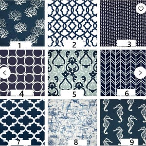 May include: Nine fabric swatches with various patterns. The patterns include coral, geometric shapes, chevrons, and seahorses. The color palette is primarily navy blue and white, with some light blue and gray accents.