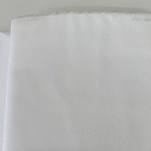 Muslin Mates Swirls White cotton quilting fabric by Moda – tonal white swirls print on 100% cotton, 44" wide